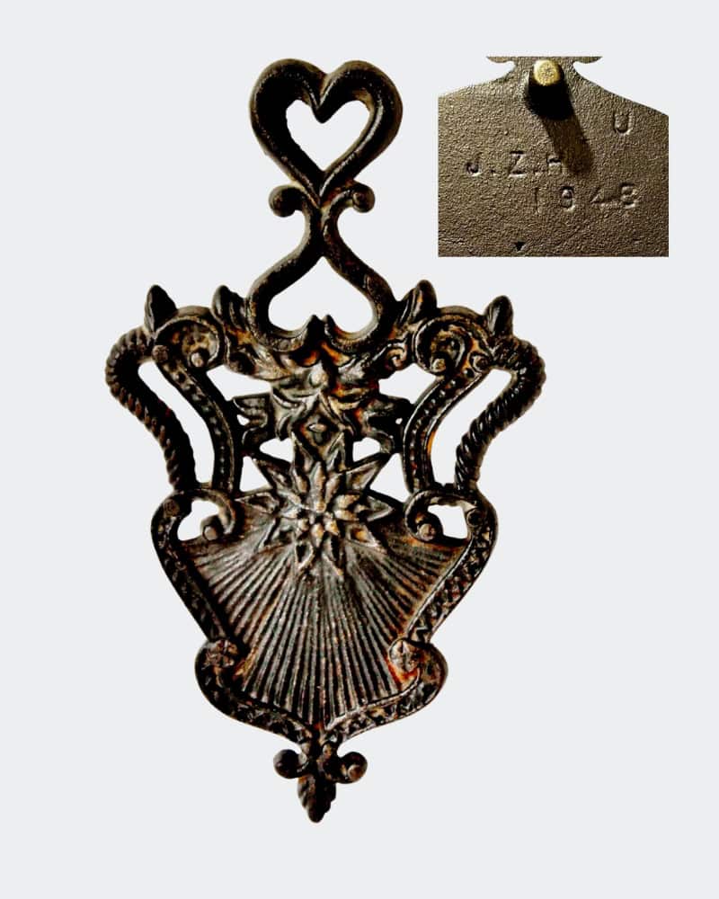 vintage cast iron trivet JZH 1948 U Sunburst or Order of Cinncinati