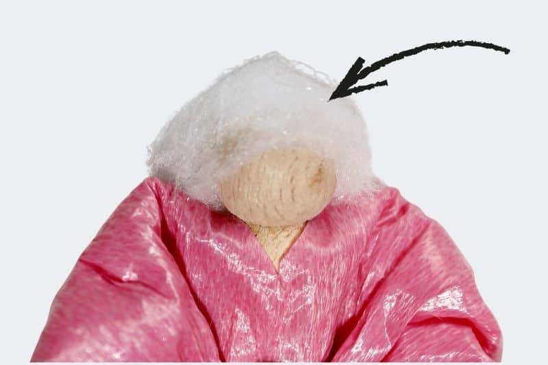 Fiber Fill hair on clothespin angel arrow pointing to fiber fill hair on clothespin angel