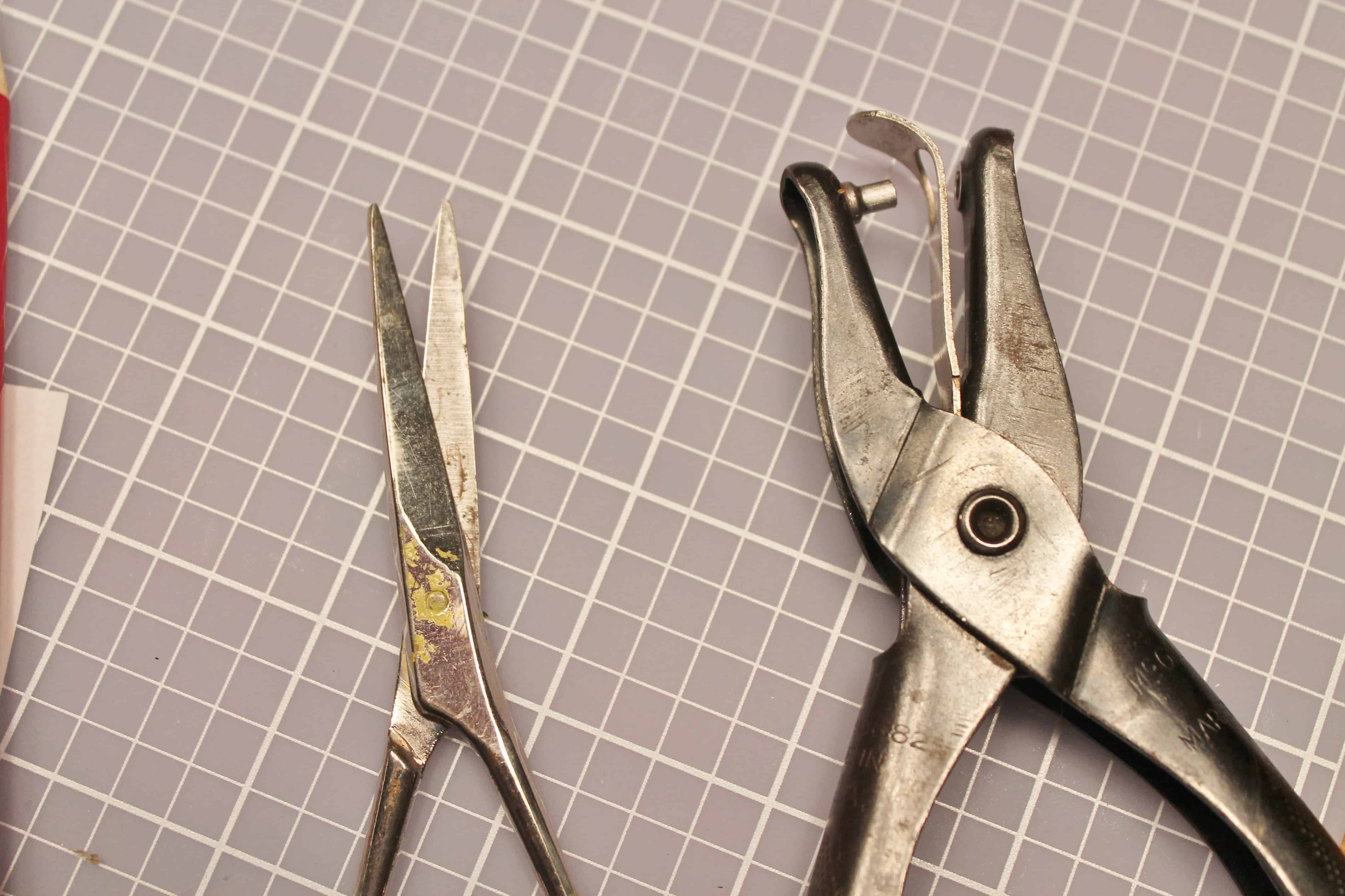 Scissors and hole punch to cut out stencils