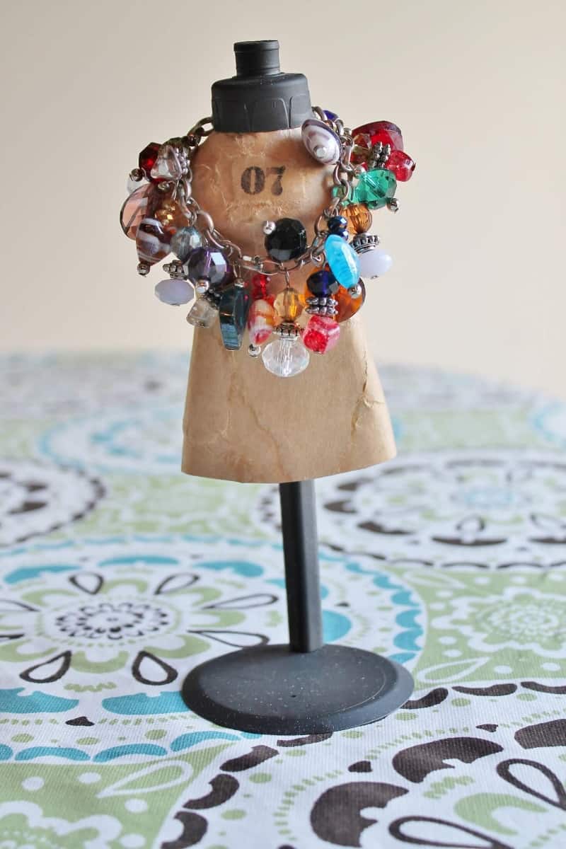 vintage style mini mannequin holding bracelets