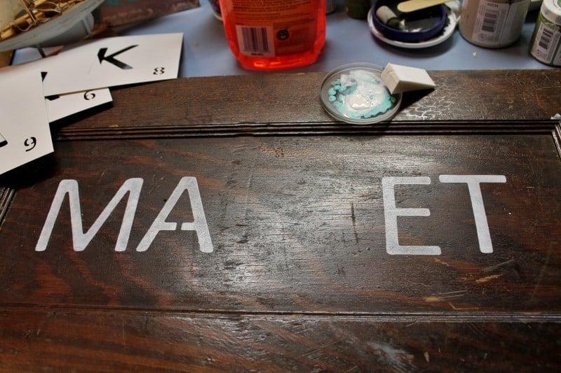 stenciling a vintage cupboard door