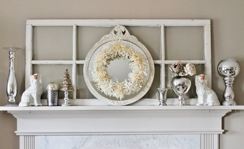 winter white mantel with white wreath, white mirror, and french door