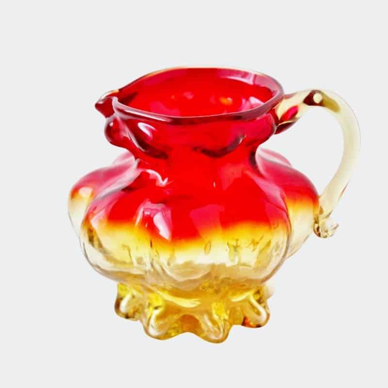 red and yellow handblown amberina pitcher or creamer