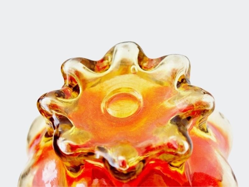 Scalloped base of amberina pitcher showing polished pontil mark