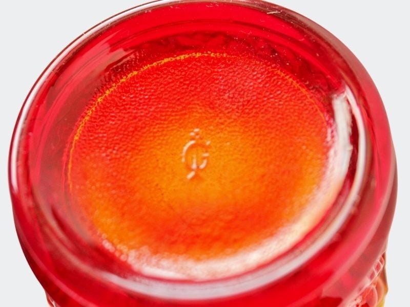 base of orange tumbler showing IG mark