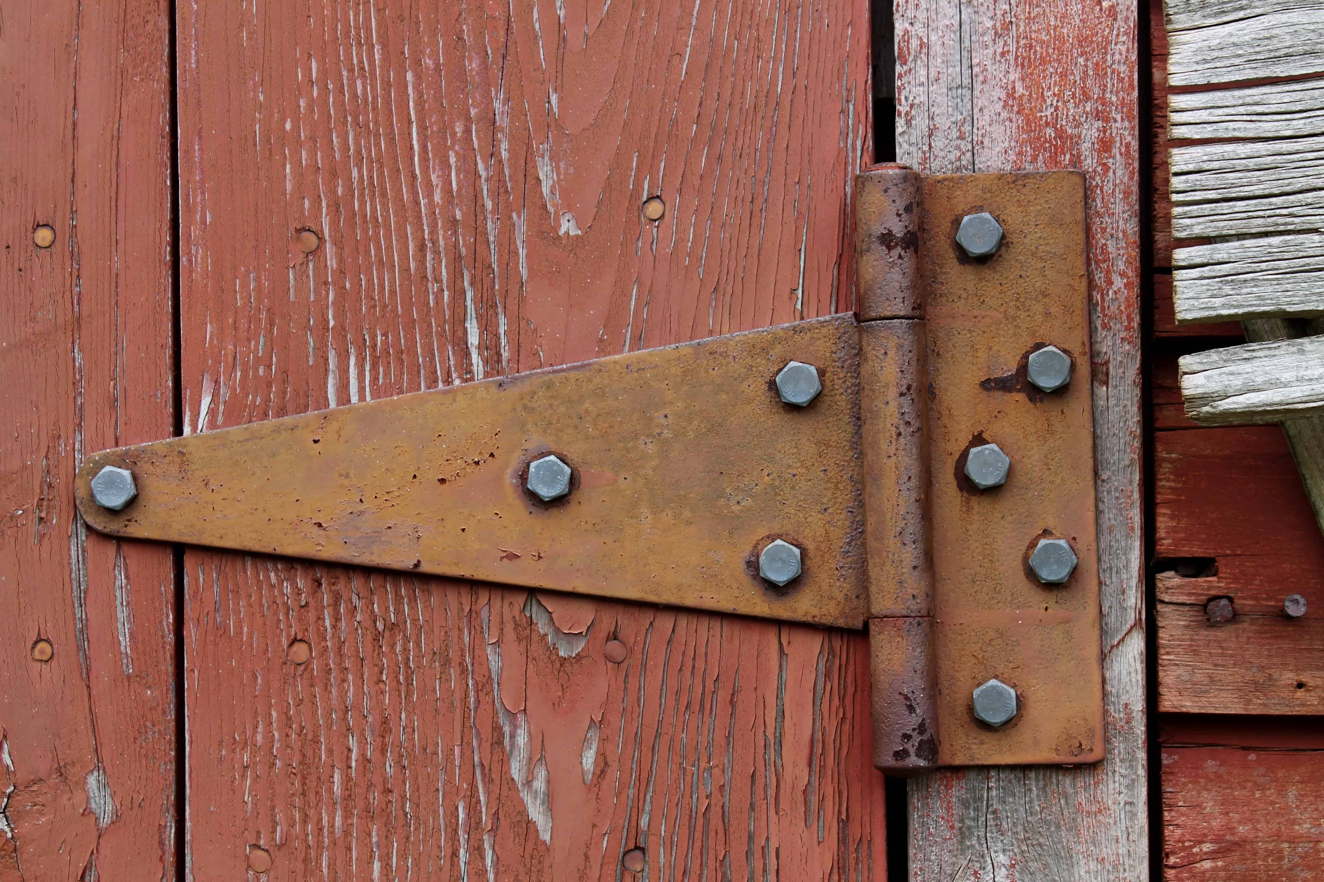 Old Hinge on Red Barn