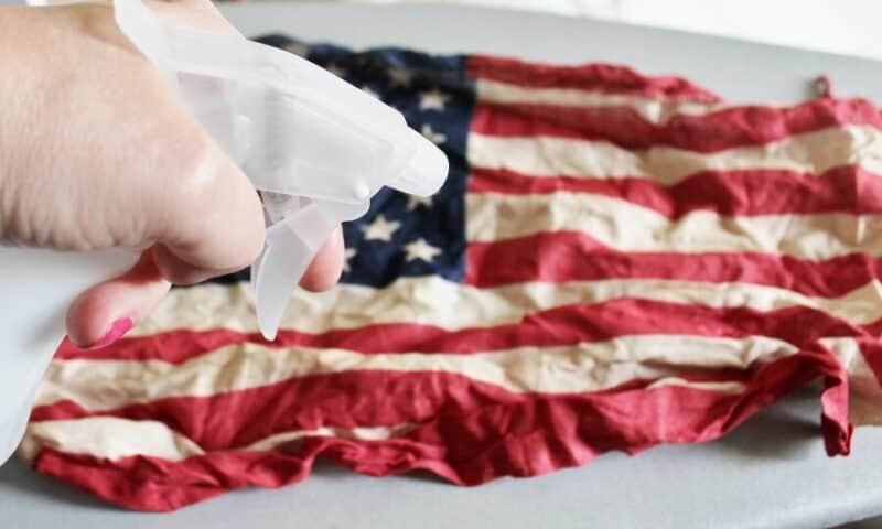Spritzing a dyed american flag with water