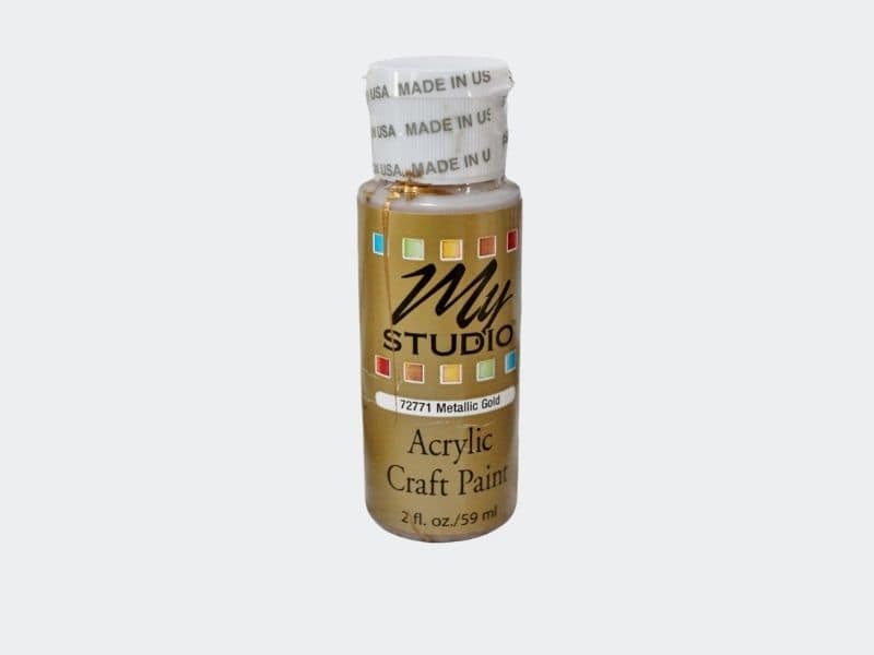 small bottle of gold craft paint