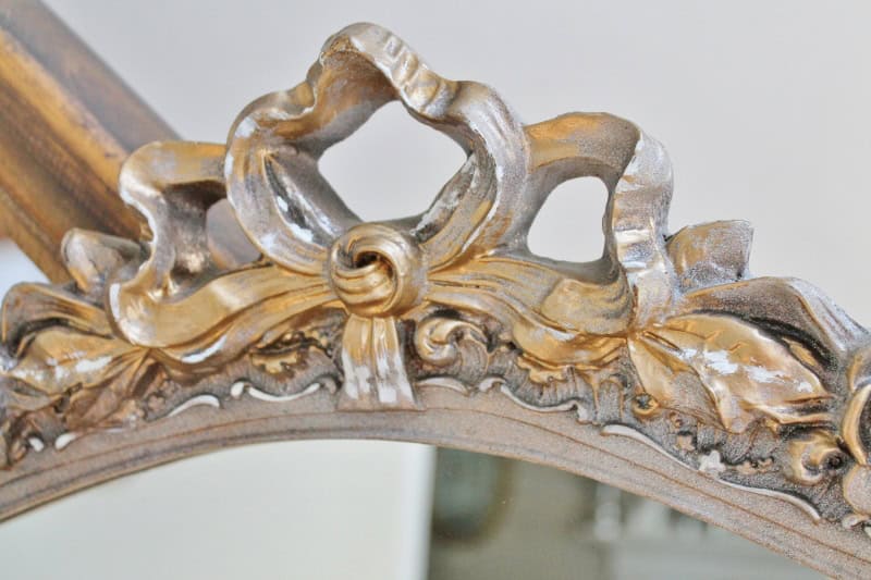 Close up of shabby gold mirror