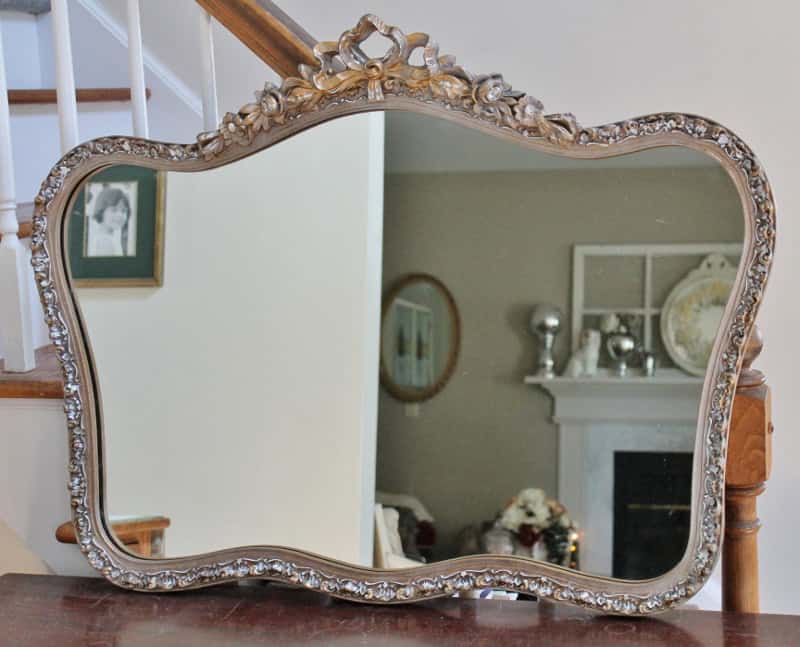 Ornate gold mirror looking shabby