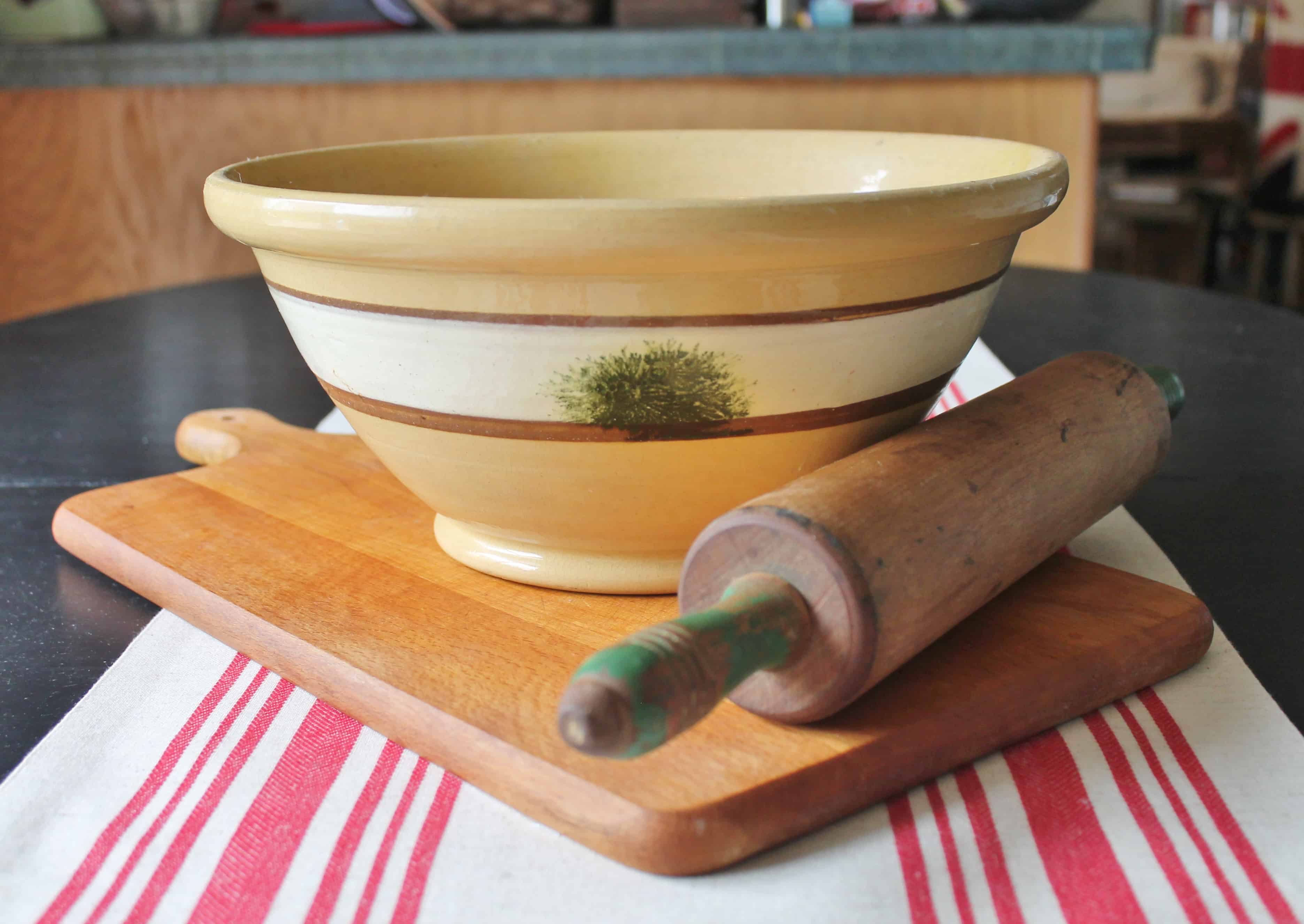 Yellow ware bowl, rolling pin, cutting board (2)