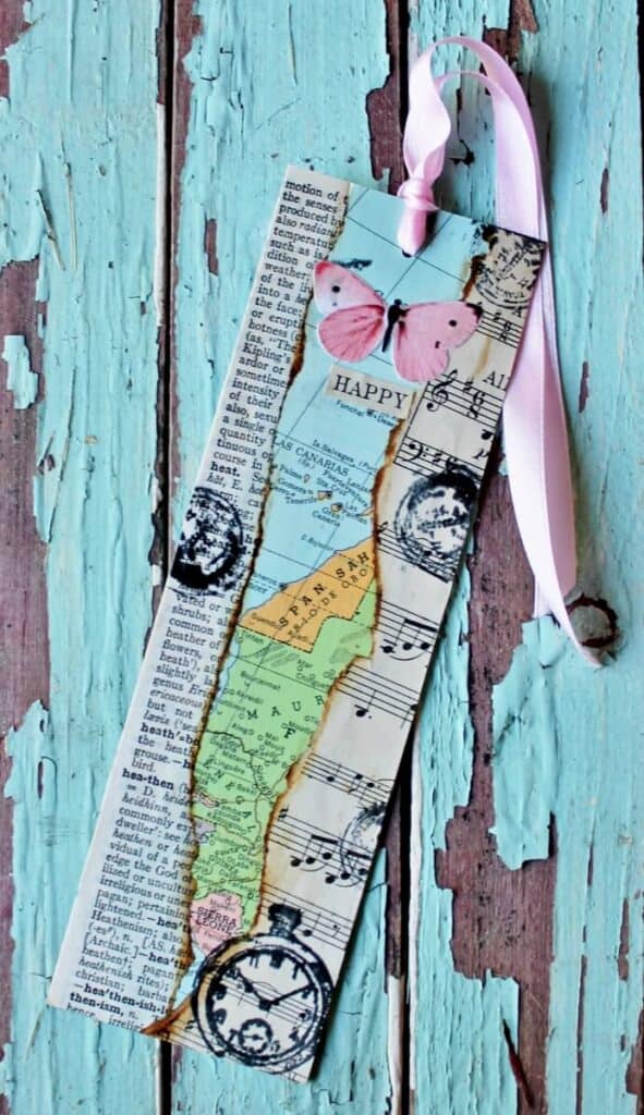 1 mixed media bookmark with pink butterfly on chippy aqua wood background