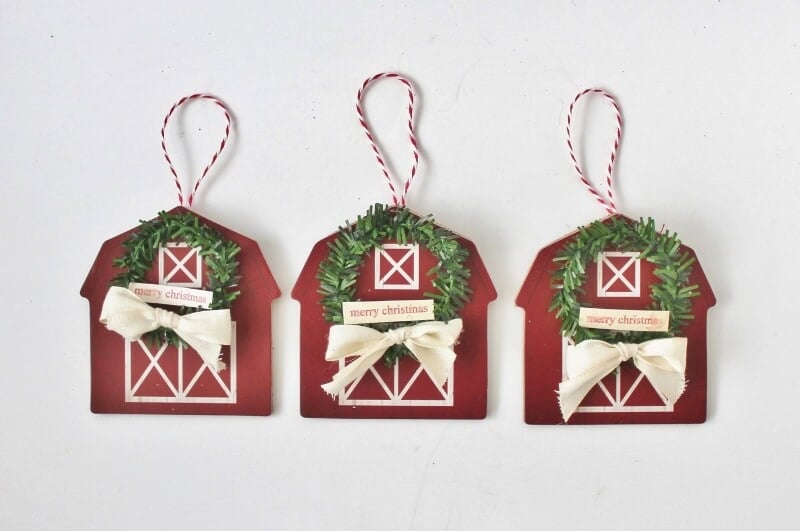 red barn ornaments decorated with mini wreaths
