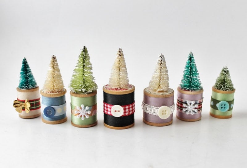 7 bottle brush trees on spools of thread: christmas decorations