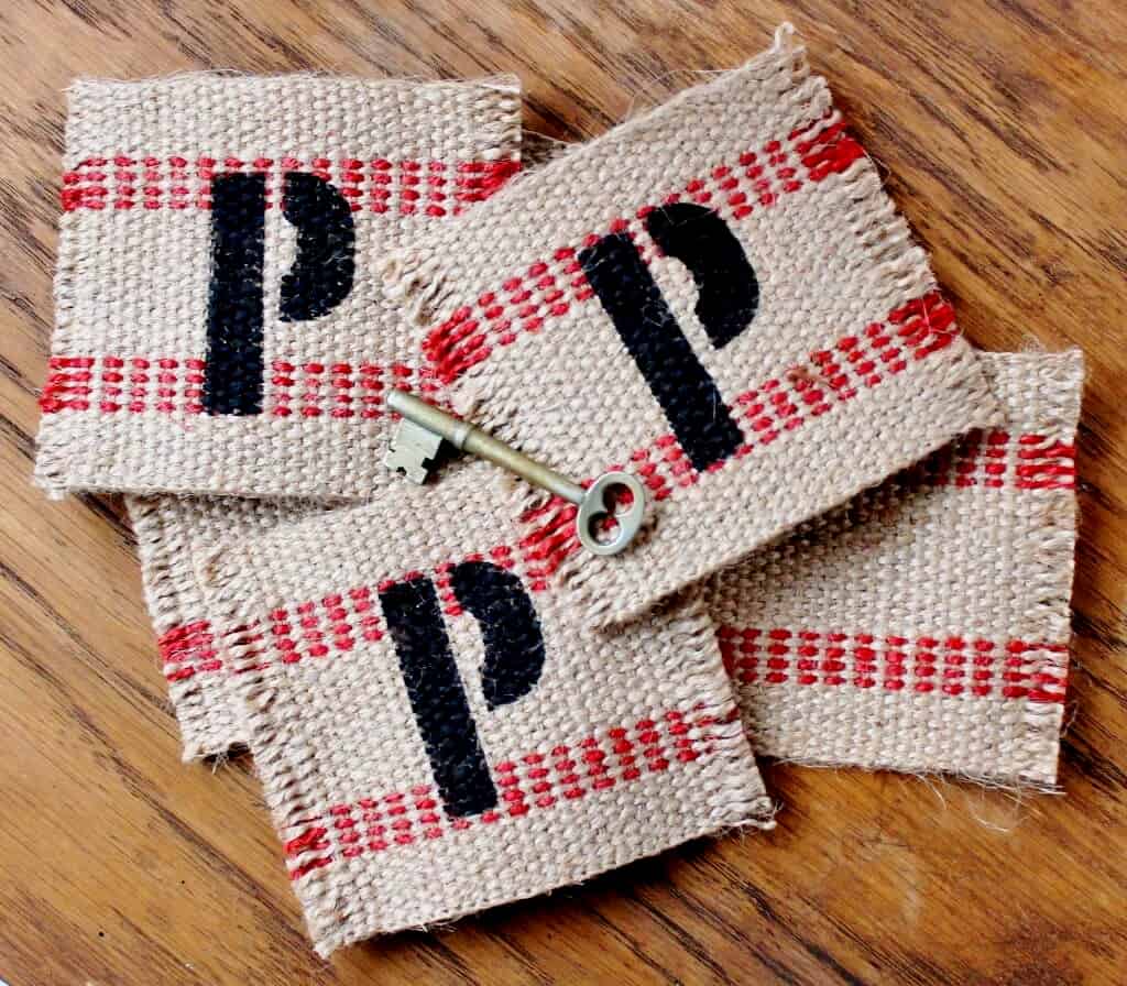 jute webbing coasters with the letter P stenciled on them