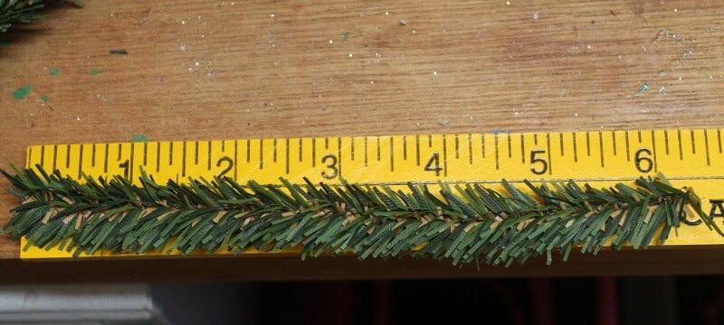 Yellow ruler measuring pine garland