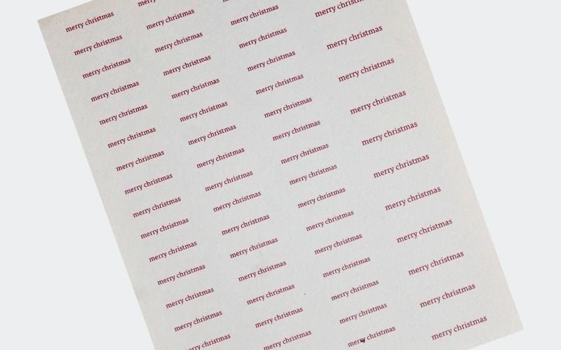 sheet filled with "merry christmas" 