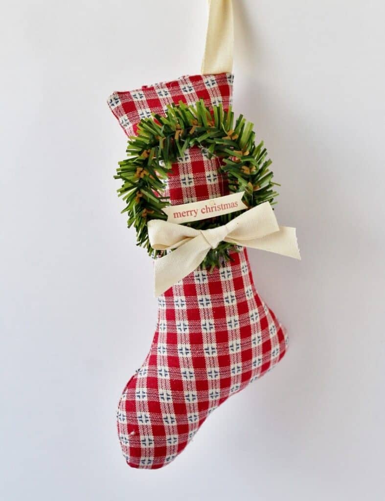 red and white check stocking with mini wreath