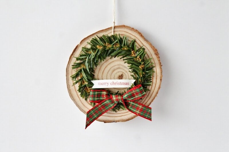 wood slices decorated with mini wreaths