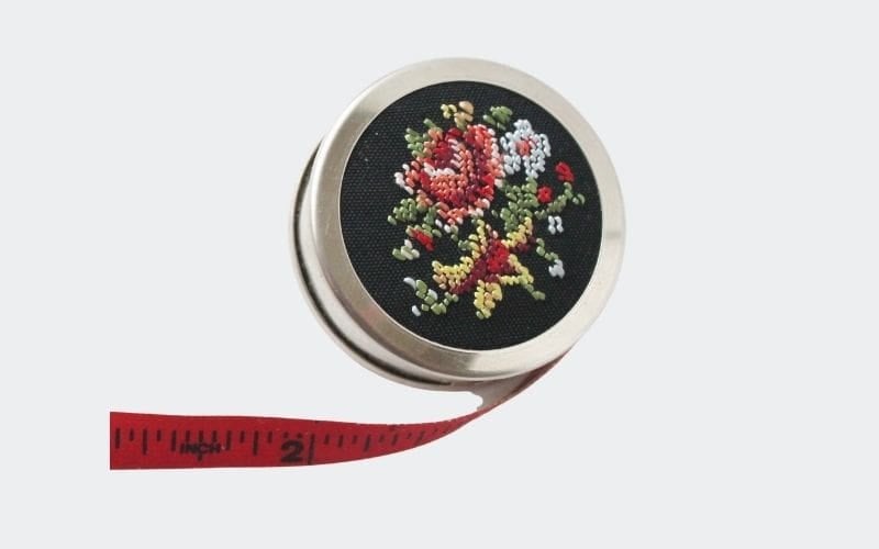 Round measuring tape with embroidered design