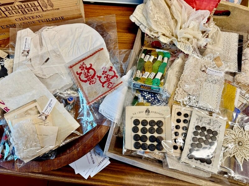 Antique french sewing notions in a basket