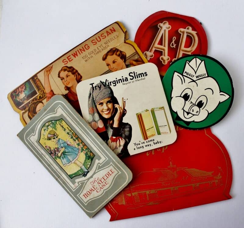 small collection of colorful vintage needle cases