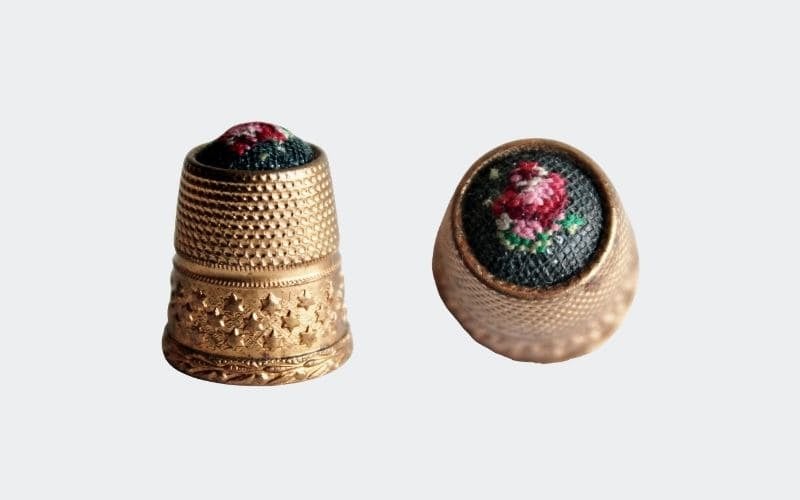Brass thimble with embroidered top