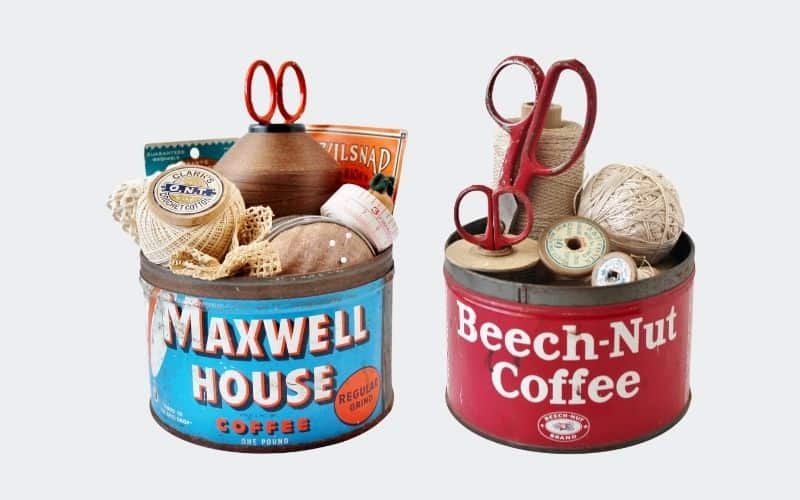 1 blue tin, 1 red with vintage sewing notions