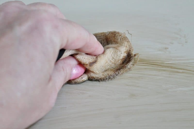 applying wax to the coffee table makeover