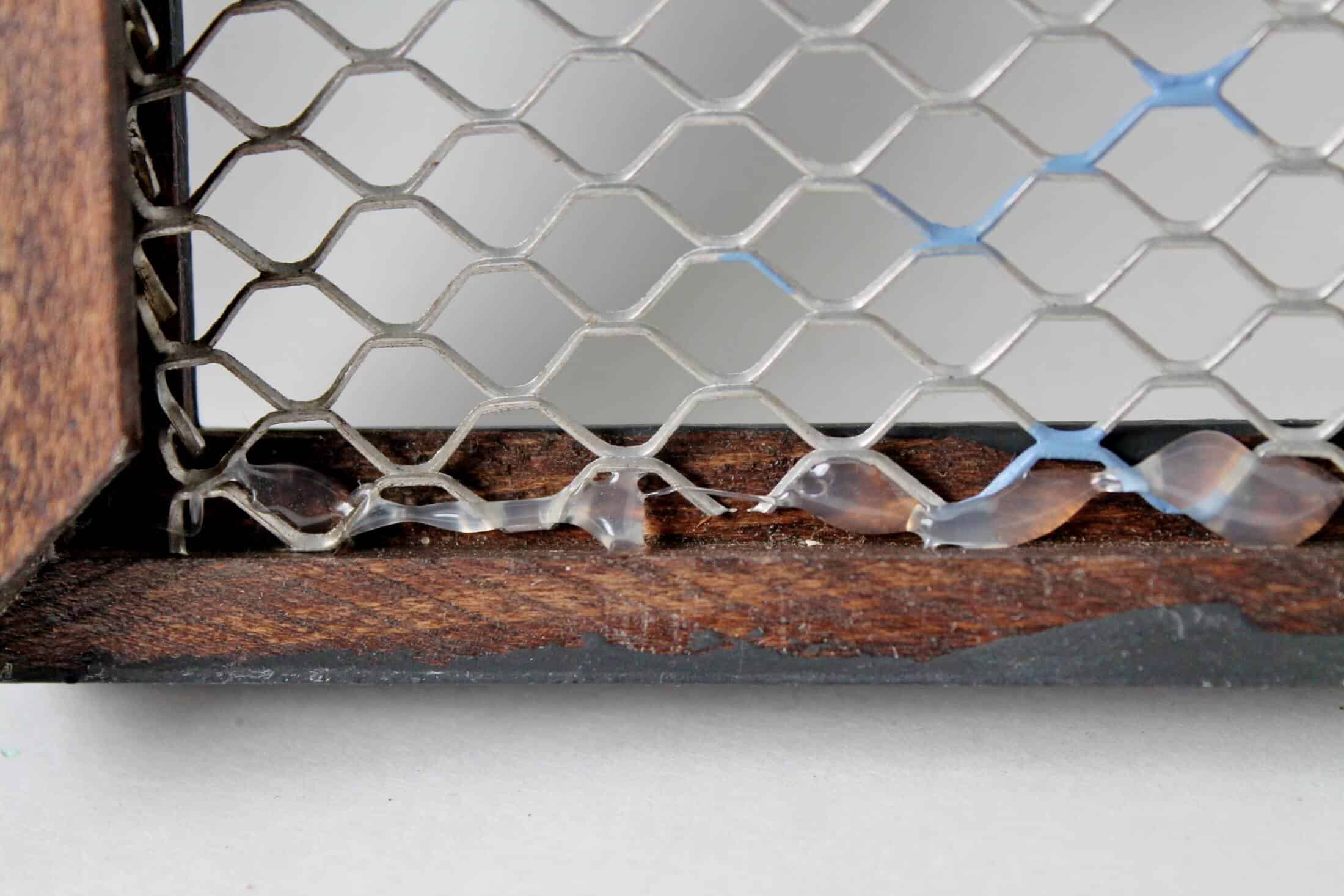 close up of hot glue and vintage gutter guard