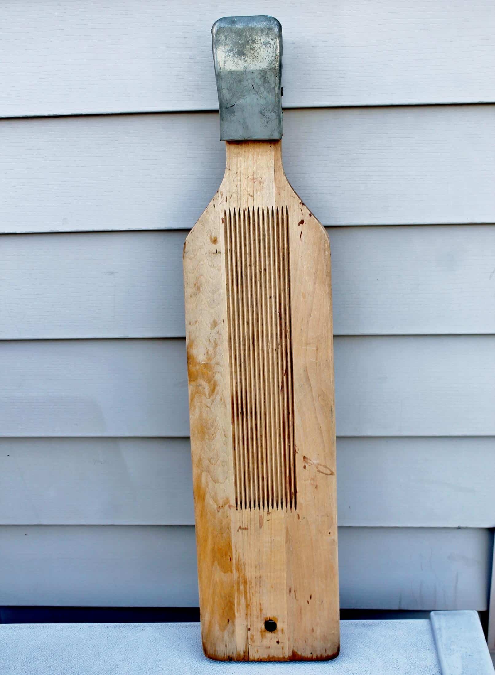 thrifted wood and metal fish scaler