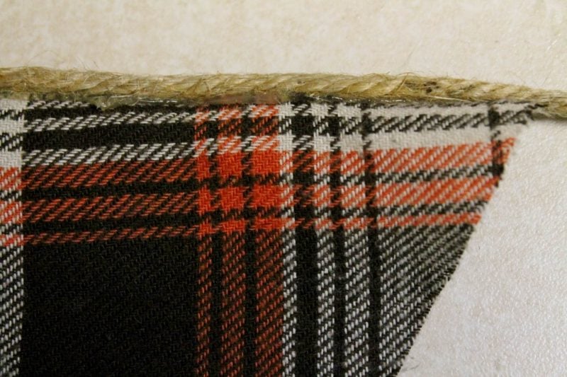 gluing jute to the top of my thrifted flannel shirt pennant
