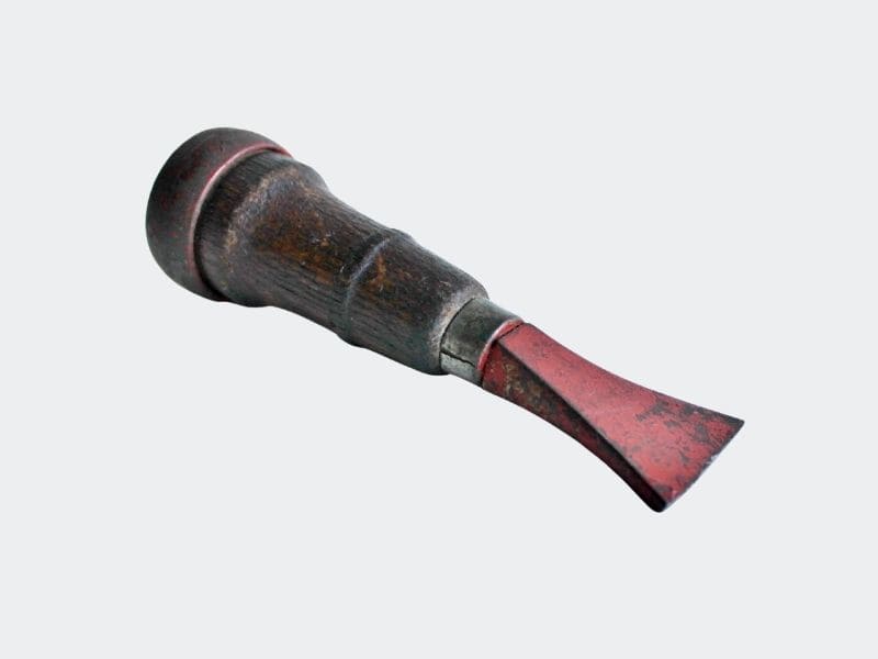 small tool with red blade and oak handle