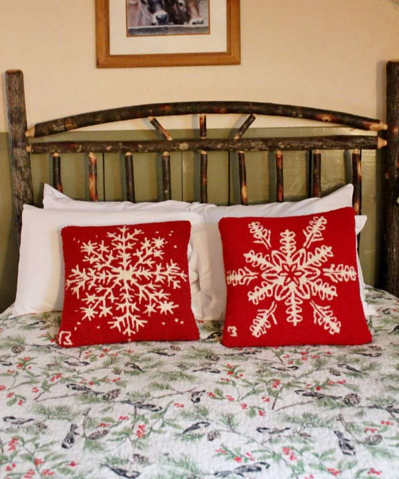 christmas decorated bedroom at the ira allen house