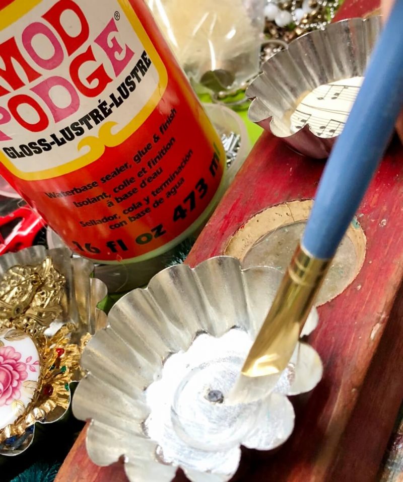 applying modge podge to tart tin 
