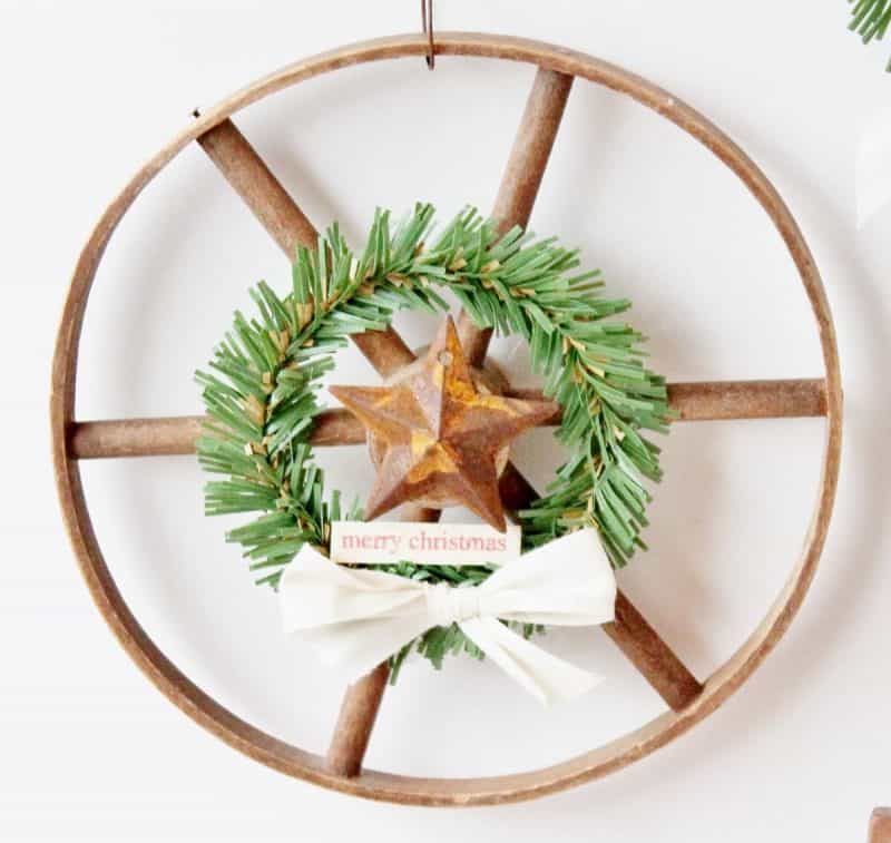 Wooden wheel with mini wreath 