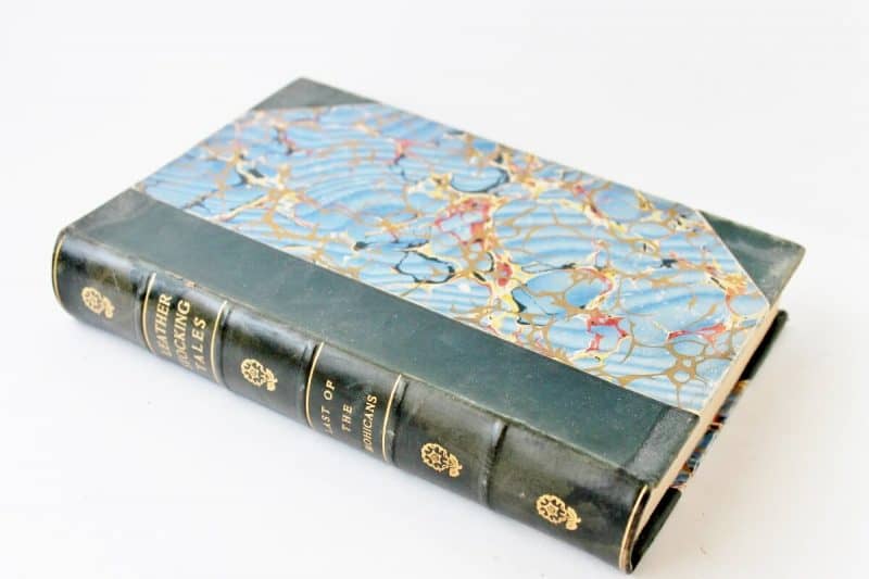 Antique copy of Last of the Mohicans with leather binding and marbelized cover