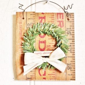 mini wreath with white bow on yardstick background