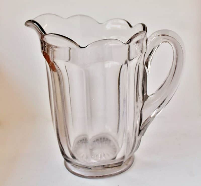 antique clear glass panelled pitcher