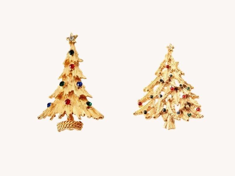 2 small gold christmas tree pins with colorful ornaments