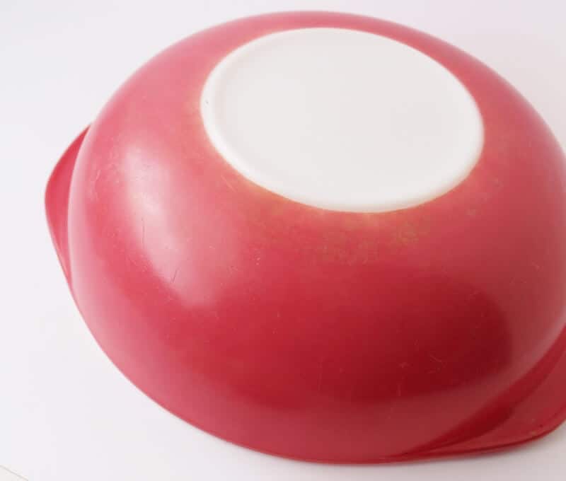 bottom of vintage flamingo pyrex casserole after waxing