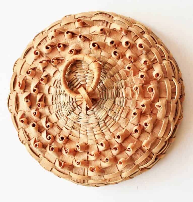 vintage basket lid with porcupine twist decoration
