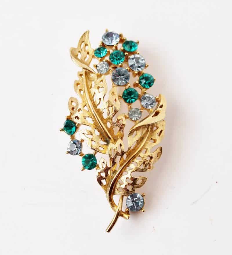 gold and rhinestone brooch
