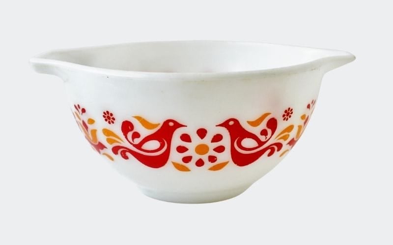 white glass bowl with red birds and flowers
