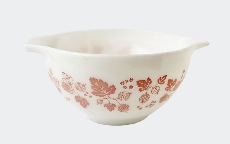 white bowl with pink leafy decoration