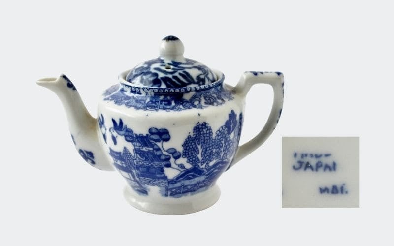 small blue and white china teapot with mark: Japan