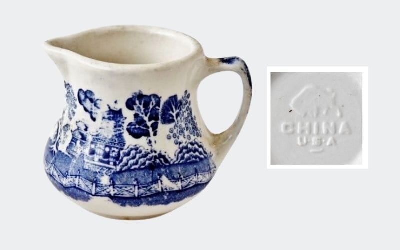 blue and white china creamer with buffalo china mark