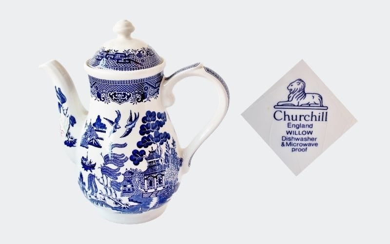 white coffee pot with blue decoration and bottom mark: Churchill, England