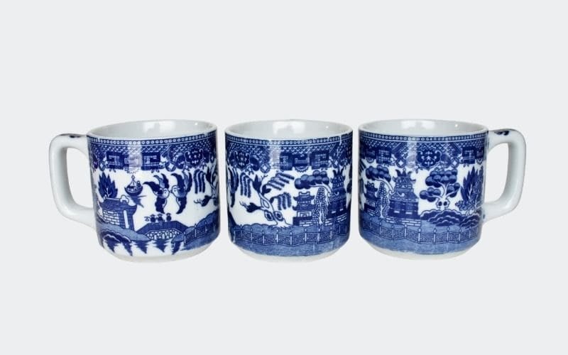 three blue and white china mugs