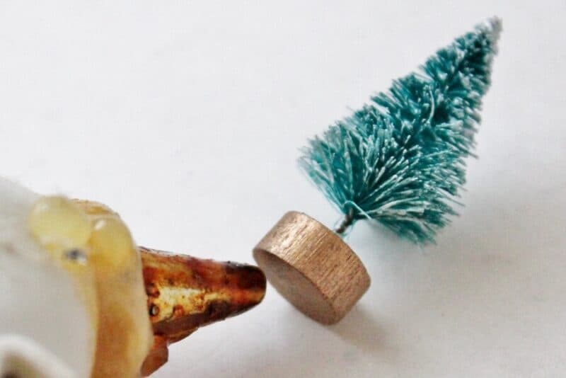 Applying glue to bottle brush tree